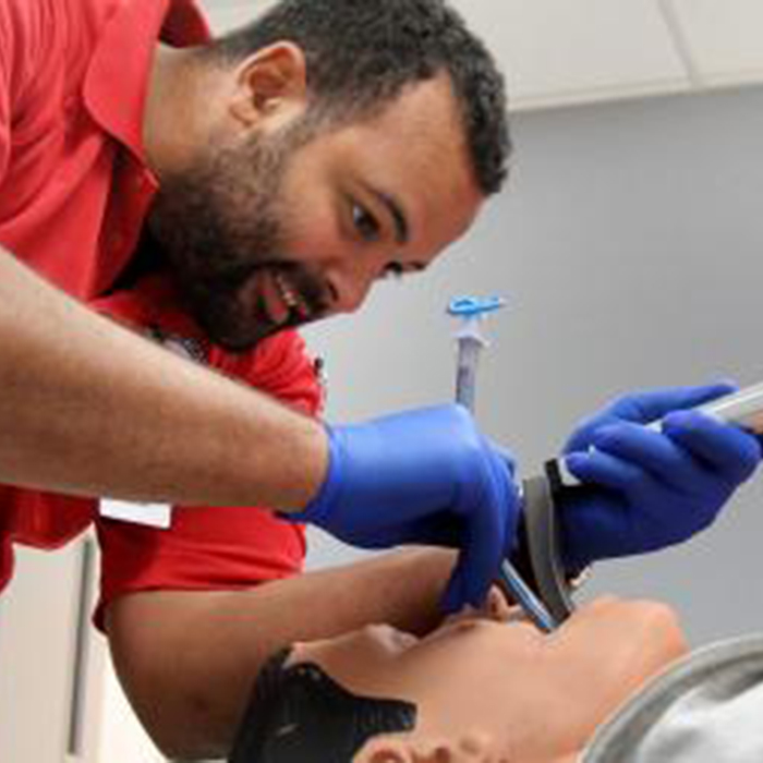 a man intubating a simulation patient