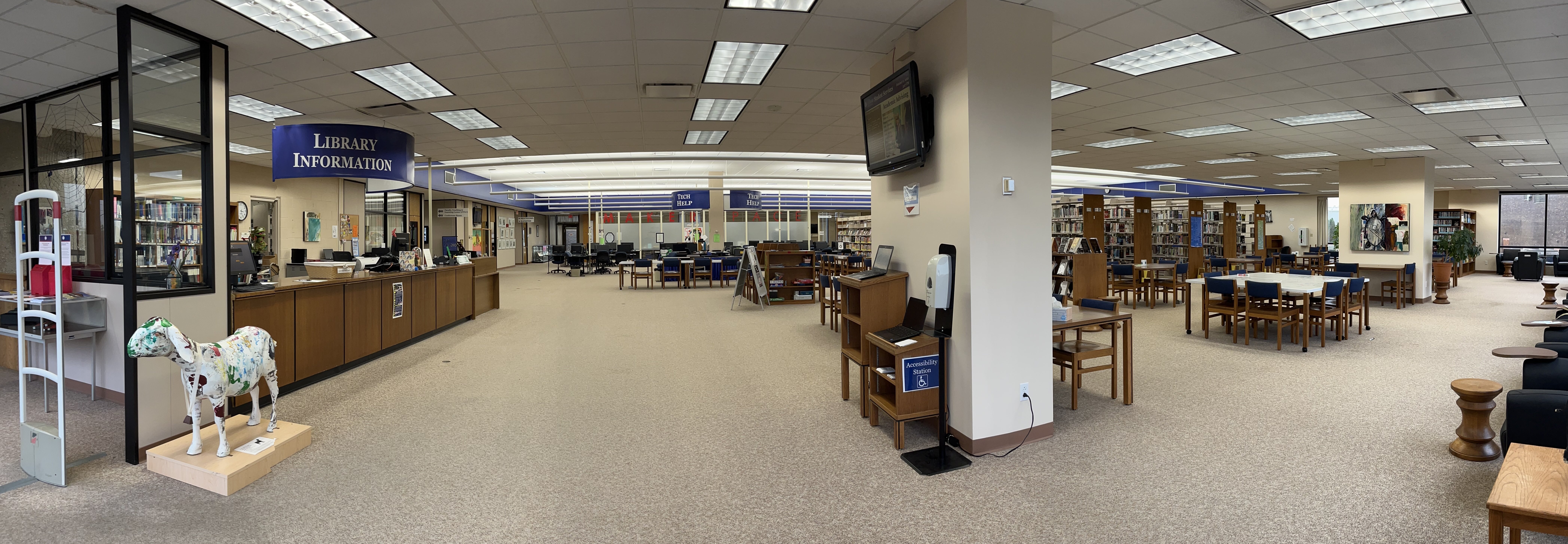 View of library front desk and help desk.