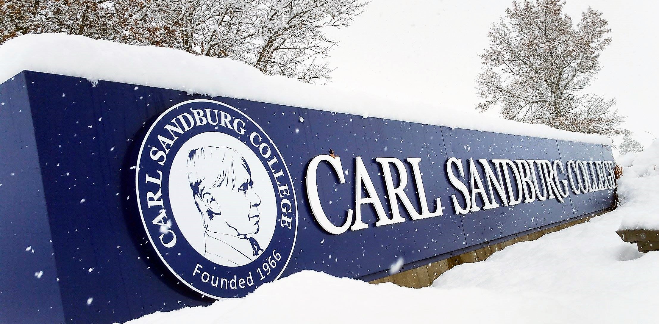 carl sandburg college main campus sign covered in snow.