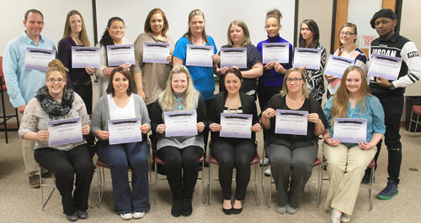 Group of RN students holding their certificates. 